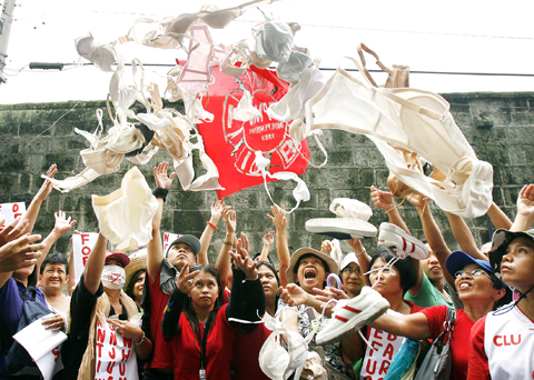Displaced workers of Triumph International Philippines at protest